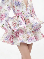 Blooming ruffle mini dress with a floral print and v-neckline.
