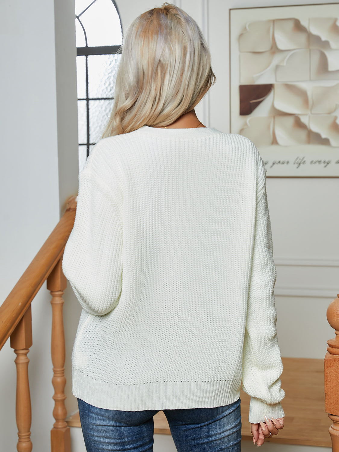 Chunky knit button-down cardigan in white acrylic with a relaxed fit and ribbed details.