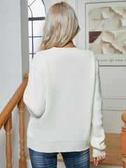 Chunky knit button-down cardigan in white acrylic with a relaxed fit and ribbed details.