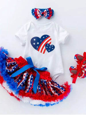 4-piece baby outfit with patriotic heart print bodysuit, ruffled skirt, headband, and shoes.
