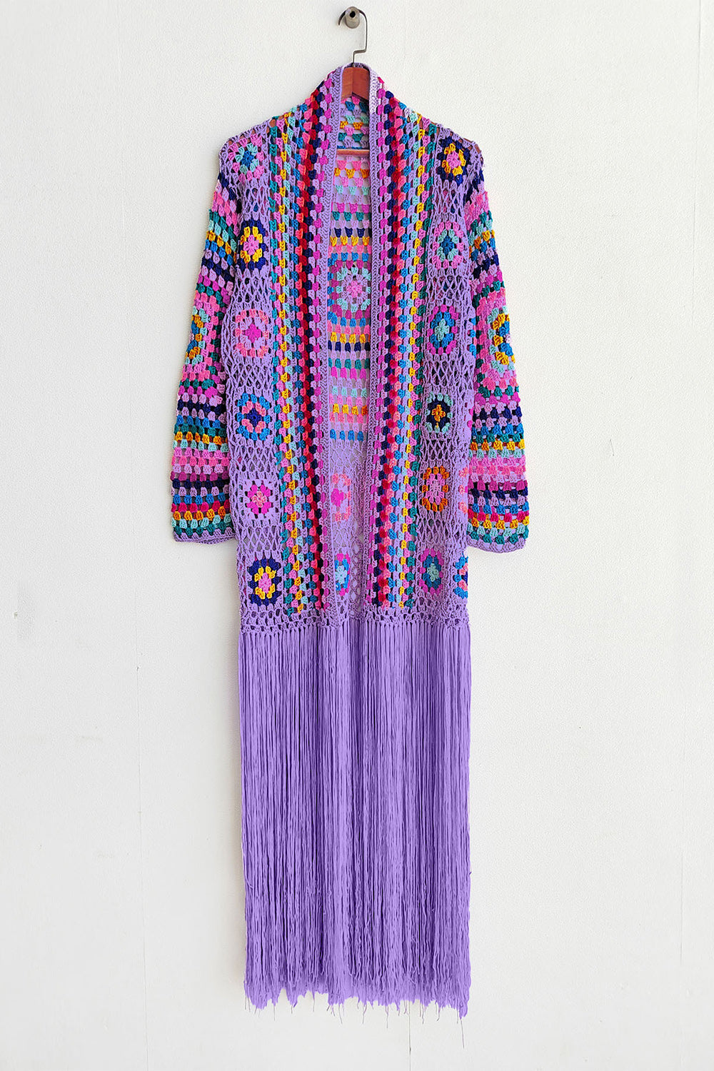 Lilac granny square crochet duster with multicolor details and long fringe.