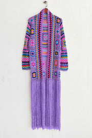 Lilac granny square crochet duster with multicolor details and long fringe.