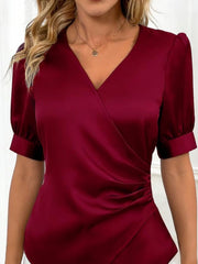 Burgundy satin wrap blouse with ruched side detail and short puff sleeves