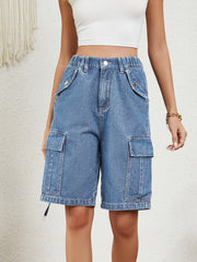 Denim bermuda shorts in medium wash with cargo pockets and drawstring hem