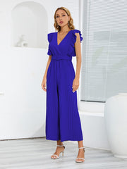 Royal blue pleated ruffle wrap jumpsuit with belt and V-neckline.