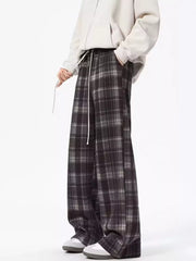 Plaid drawstring sweatpants in black with a relaxed fit and white drawstring.