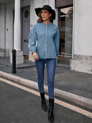 Dusty Blue textured ruffle collar peplum blouse with button front and long sleeves.