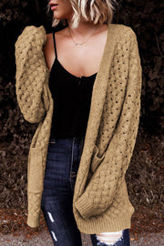 Textured open-knit pocket cardigan in caramel acrylic with a relaxed fit.