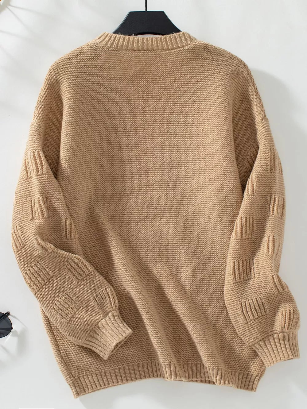 Camel chunky knit cardigan with textured sleeves and ribbed cuffs.
