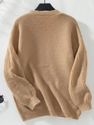Camel chunky knit cardigan with textured sleeves and ribbed cuffs.