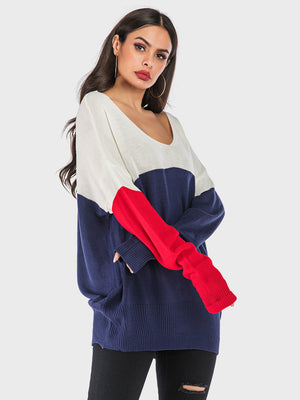 Colorblock knit sweater with V-neck, off-shoulder style, and long sleeves in dark blue, white, and red.