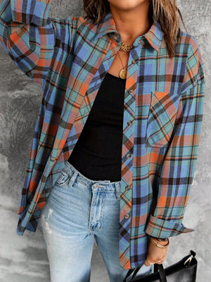 Oversized plaid shacket in blue, orange and teal with relaxed fit and chest pocket.