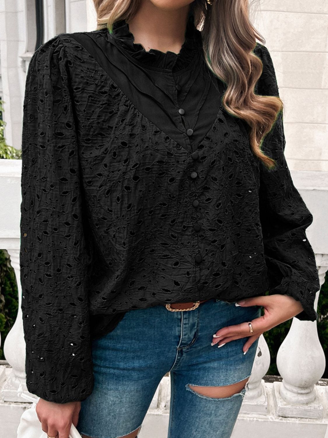 Black eyelet embroidered blouse with ruffle collar and button front.
