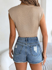 Tan scalloped crochet crop top with distressed denim shorts