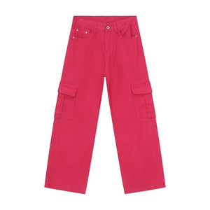 Oversized hot pink denim cargo pants with large side pockets.