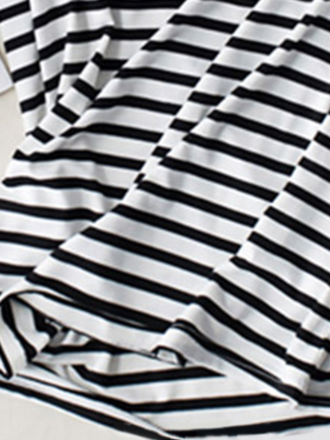 Black and white striped built-in bra tee with a casual fit.