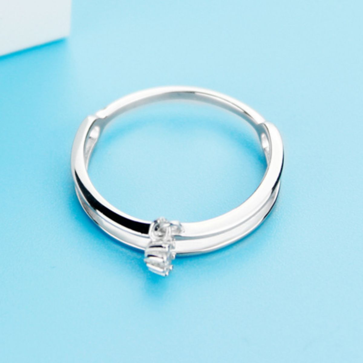 Elegant double layered sterling silver ring with small clear stones.