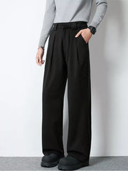 Men's black wide-leg pleated trousers with a relaxed fit and side pockets.