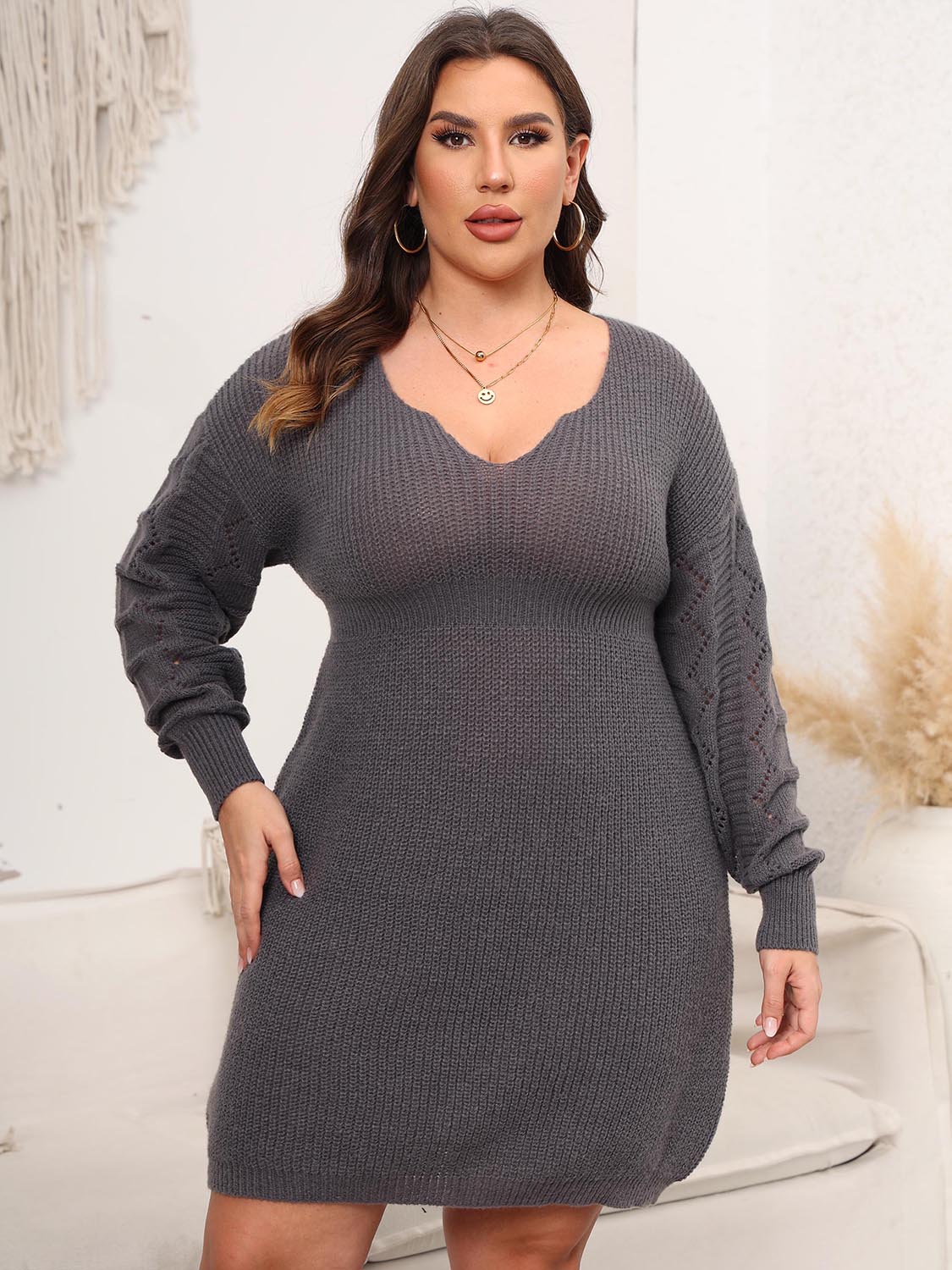 Sculpted knit midi dress in charcoal with V-neck and diamond detail on sleeves.