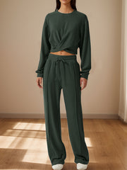 Army green knit lounge set with a cross-front crop top and wide-leg pants.