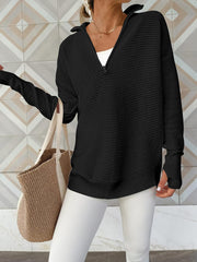 Black ribbed knit funnel neck pullover sweater with quarter zip and thumbholes.