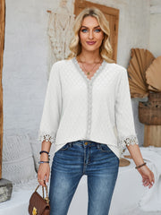 White eyelet blouse with V-neck and lace trim details