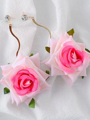 Velvet rose cascade earrings in fuchsia pink with crystal accents and gold wavy stems.