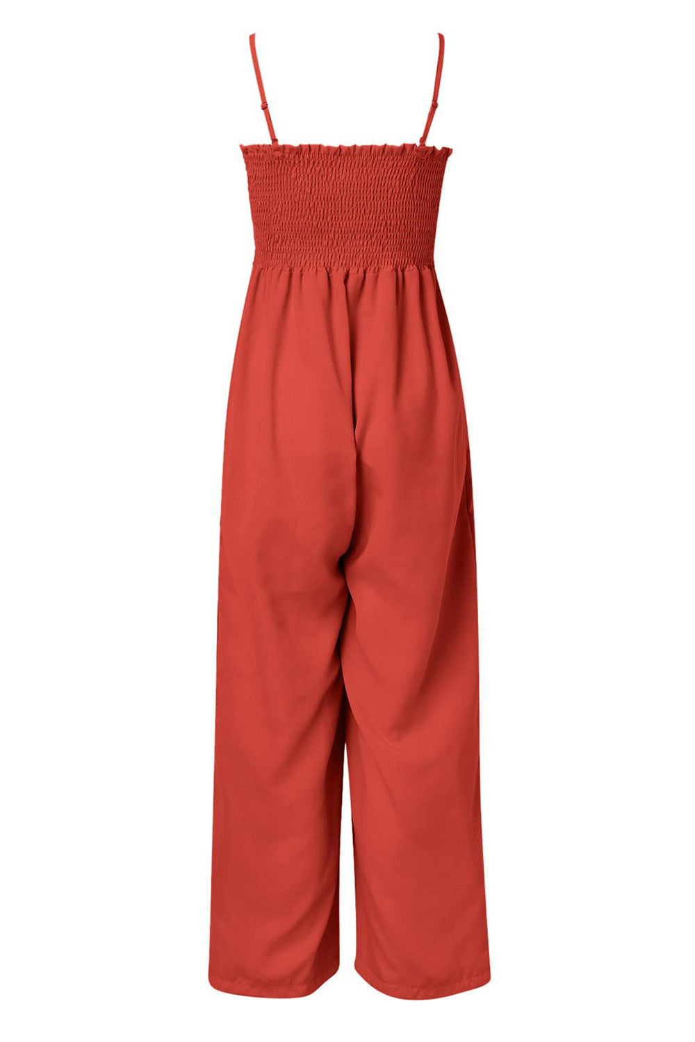 Orange-red smocked bodice palazzo jumpsuit with wide legs and spaghetti straps.