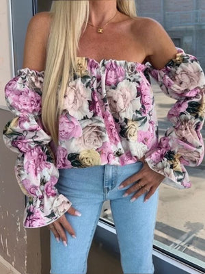 Romantic ruffle sleeve off-the-shoulder blouse in floral print with pink and white roses.