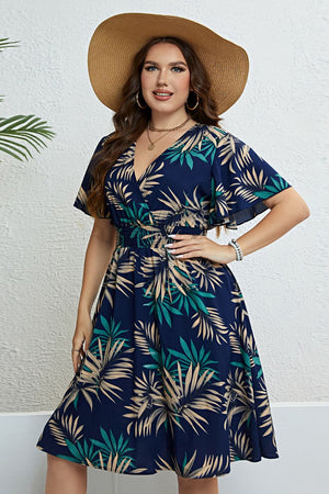 Navy empire waist midi dress with palm print, V-neck, flutter sleeves, and smocked waist.
