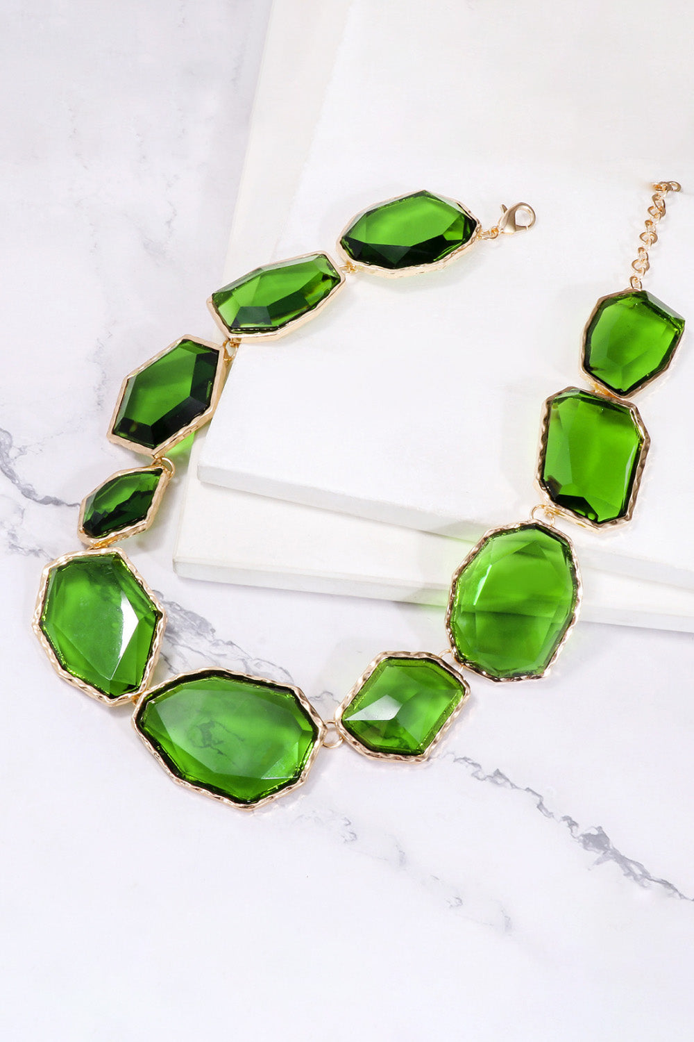 Green resin stone collar necklace with gold alloy setting and clasp.