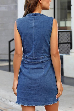 Medium wash denim button-down mini dress with pockets and frayed hem.
