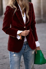 Burgundy velvet bolero jacket with button closure and gold cuff buttons, styled with a white shirt and jeans.
