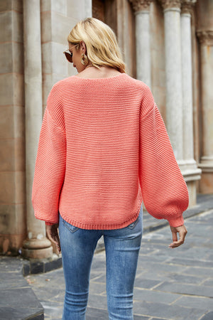 Balloon sleeve ribbed knit sweater in strawberry with crew neck and casual fit.
