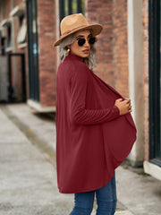 Draped cascade cardigan in wine with open front and long sleeves.