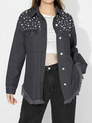 Dark denim shirt with pearl embellishments on shoulders and frayed hem.
