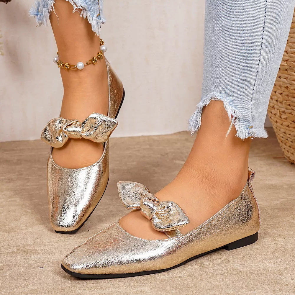 Gold square toe slip-on flats with bow detail and pearl anklet