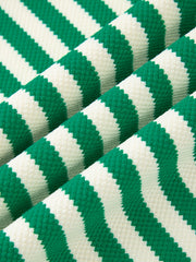 Green and white striped sweater with elastane, showing fabric texture.