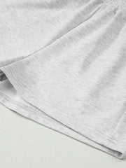 Gray cotton blend lounge shorts with heathered texture and visible stitching detail.