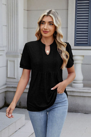 Black pleated yoke keyhole tee with short sleeves and a relaxed fit.