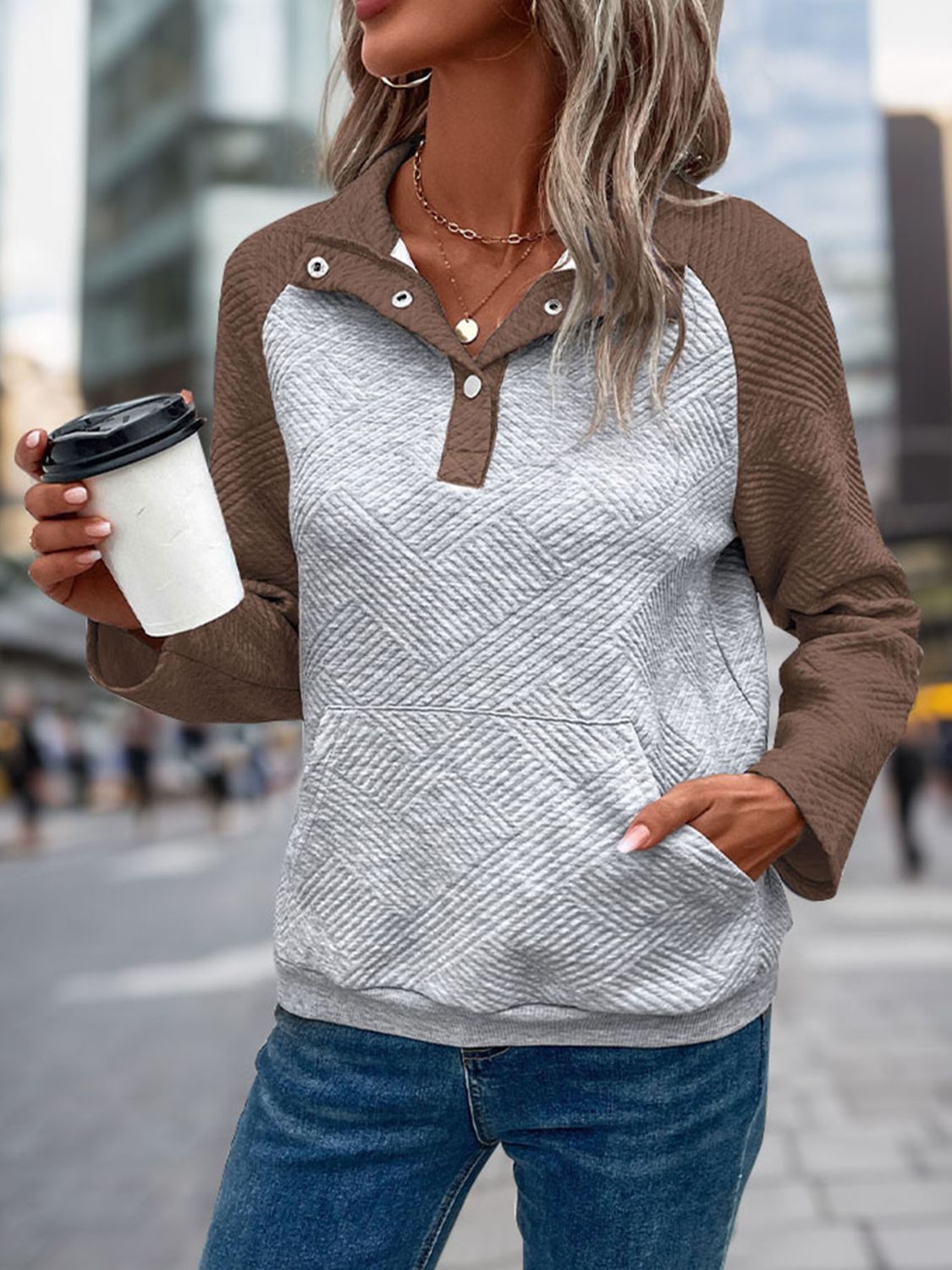 Quilted raglan sweatshirt with button henley neckline and front pocket in grey and coffee brown.