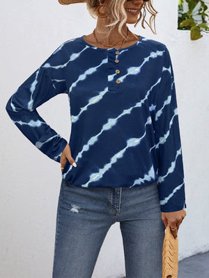 Indigo tie-dye henley top with button neckline and long sleeves