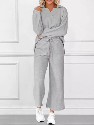 Gray V-neck textured lounge set with diagonal pattern pants and long sleeves.