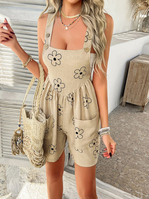 Tan daisy print romper with button straps and square neckline.