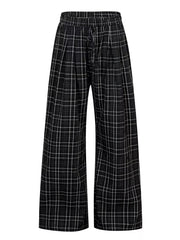 Plaid wide-leg men's sweatpants with drawstring in black and white.