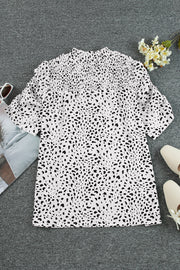 White dalmatian print blouse with shirred yoke and short sleeves