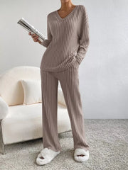 Brown ribbed knit v-neck loungewear set with wide-leg pants and long sleeves.