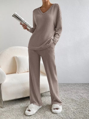 Brown ribbed knit v-neck loungewear set with wide-leg pants and long sleeves.