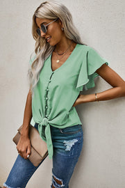 Button-down ruffle sleeve tie-front top in pastel blue with V-neckline and short sleeves.