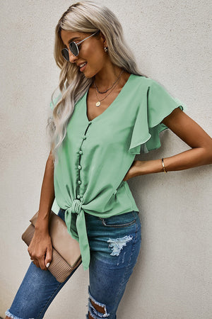 Button-down ruffle sleeve tie-front top in pastel blue with V-neckline and short sleeves.